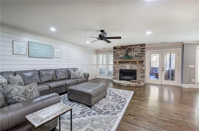 a kitchen with stainless steel appliances granite countertop a sink a stove and a refrigerator