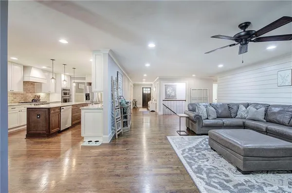 a hallway with a view of living room