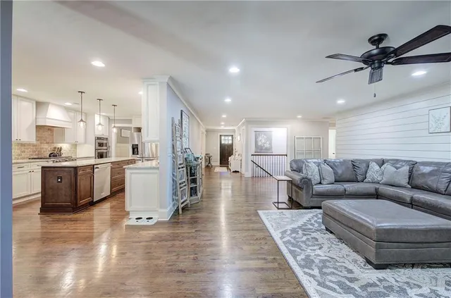 a hallway with a view of living room