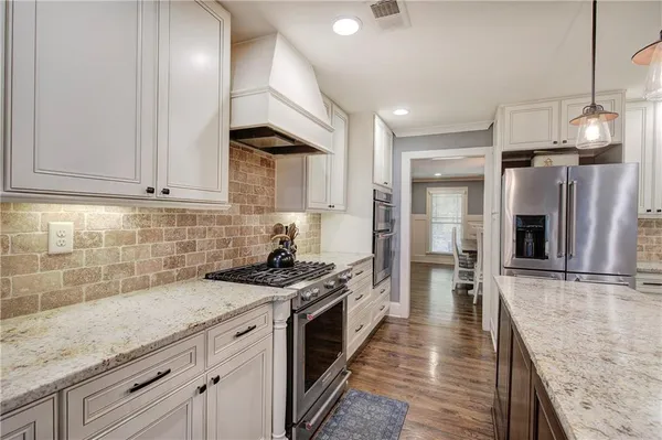 a bathroom with a double vanity sink and mirror