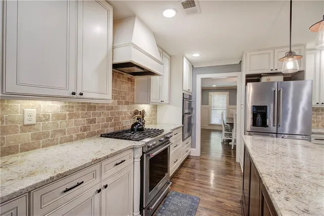 a bathroom with a double vanity sink and mirror