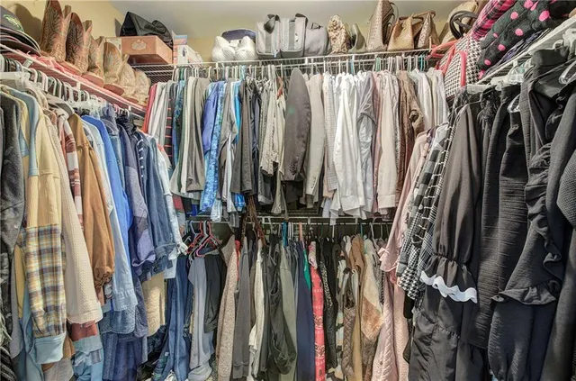 a view of a patio with a dining table and chairs with wooden floor