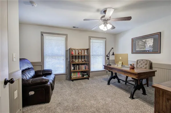 a view of a livingroom with furniture and wooden floor