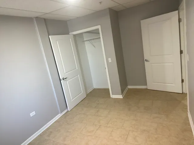 an empty room with closet area