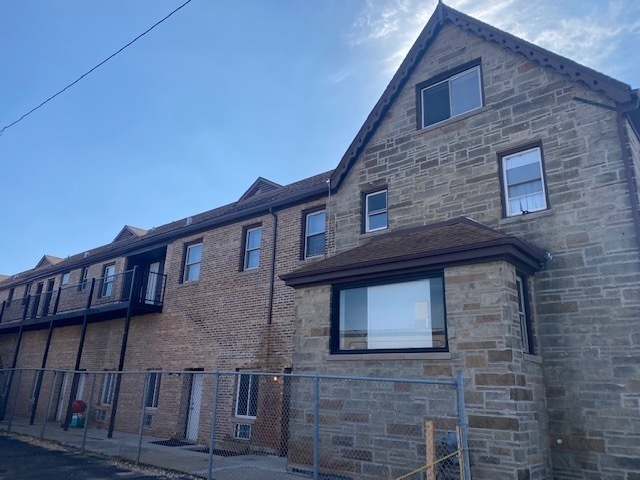 171 25th Avenue, Unit 8 Melrose Park, IL 60160 - Photo 14 of 16 a front view of a house with a balcony