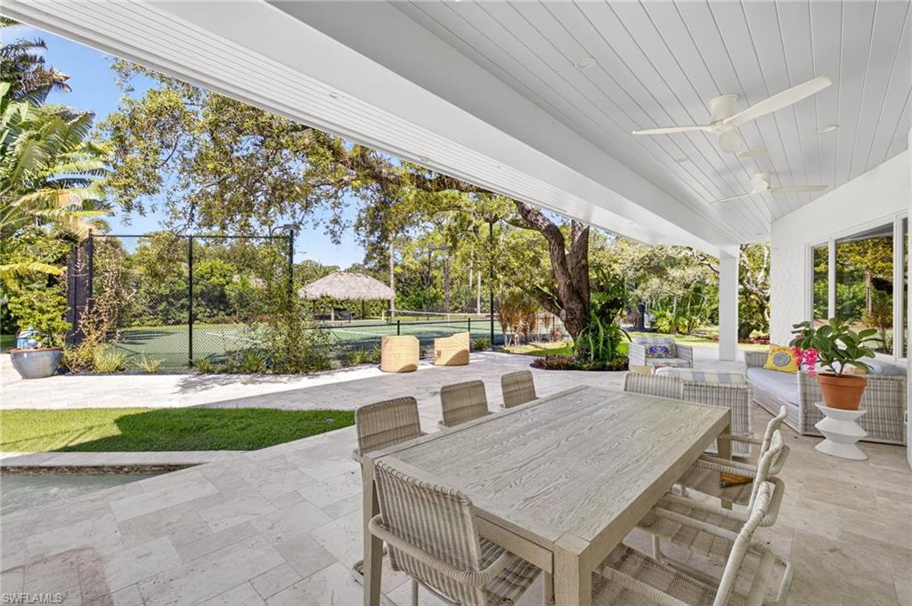 111 Caribbean Road Naples, FL 34108 - Photo 4 of 50 a view of yard with patio