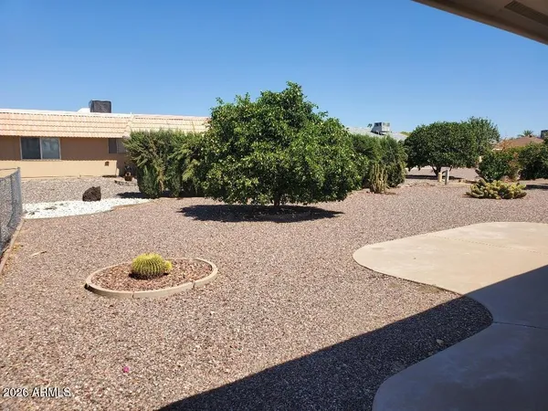 a view of a swimming pool with a yard
