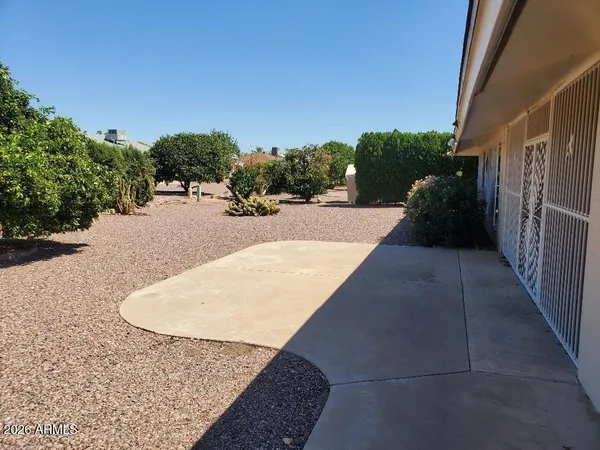 a view of balcony and yard