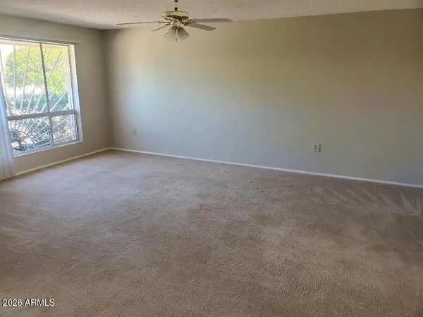 a view of an empty room with a window