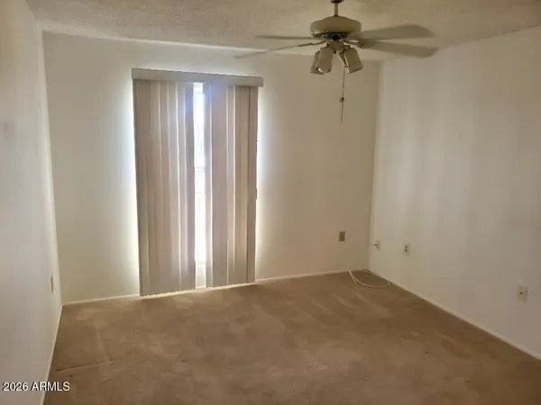 a view of a chandelier fan in a room