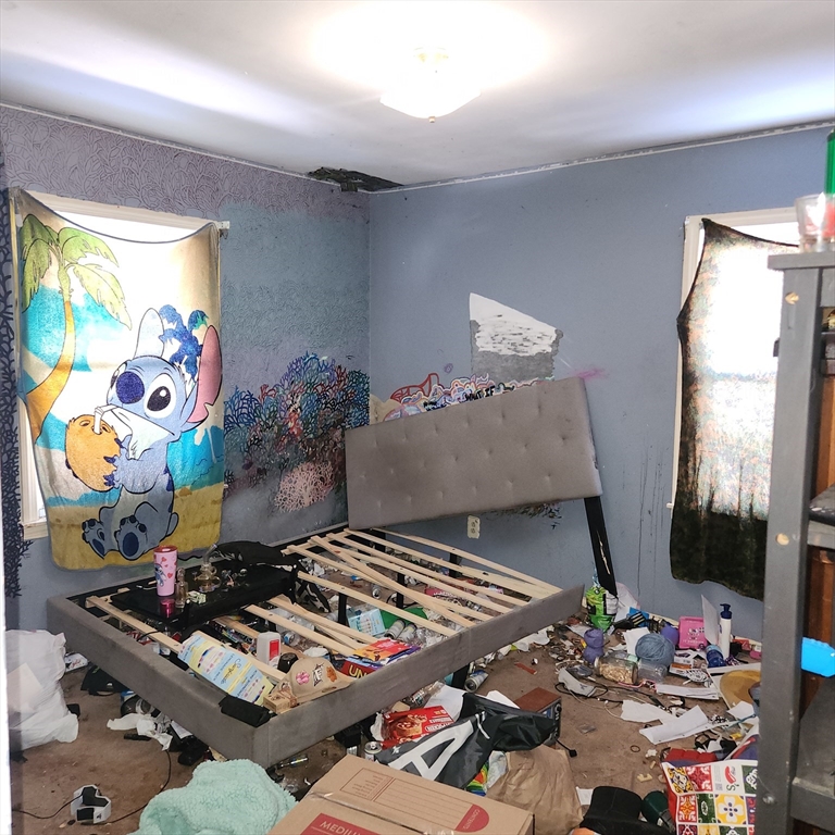 514 Dewey Street West Springfield, MA 01089 - Photo 18 of 42 a bedroom with furniture and flat screen tv