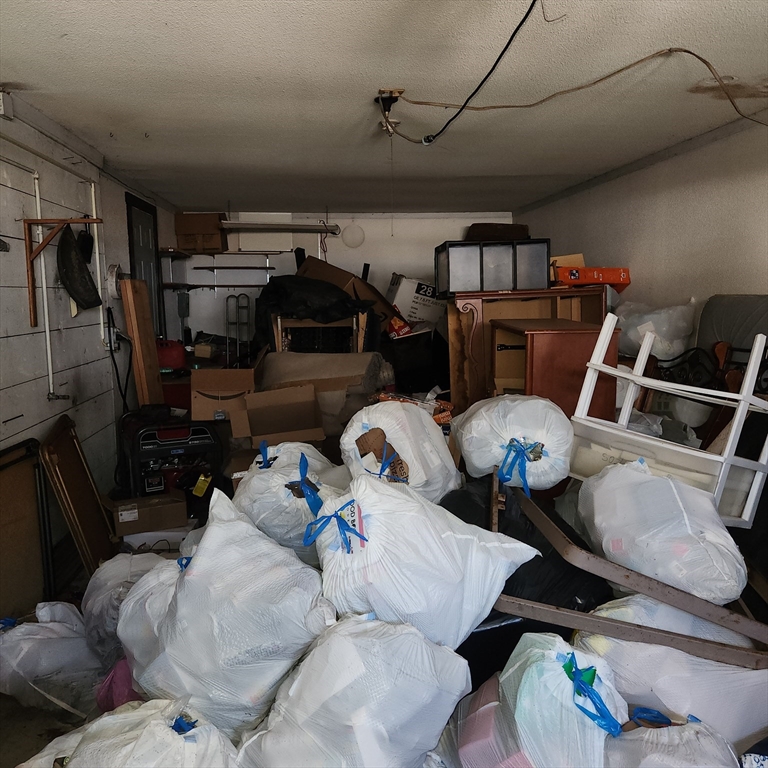 514 Dewey Street West Springfield, MA 01089 - Photo 2 of 42 a living room with lots of furniture and clothes