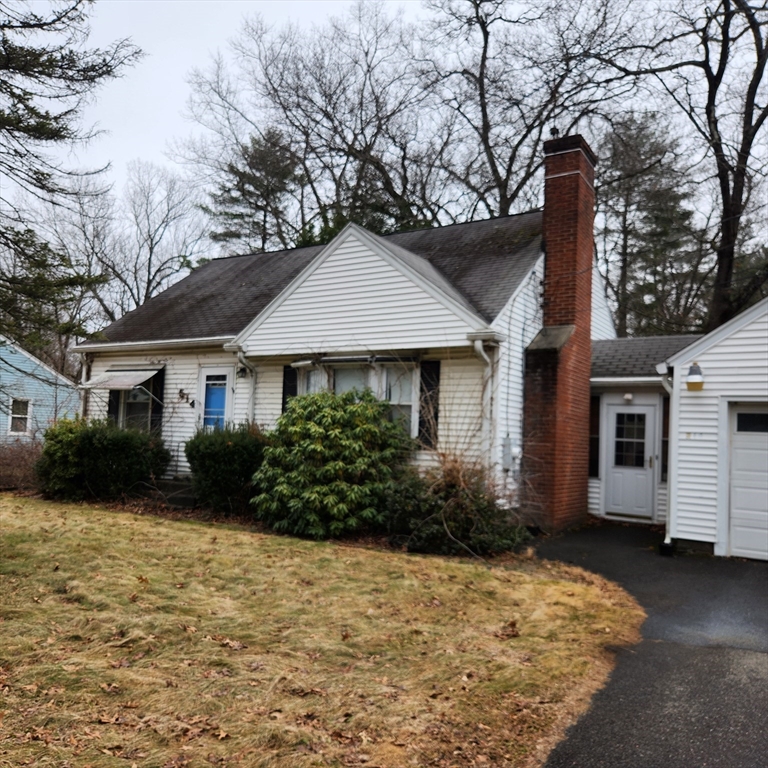 514 Dewey Street West Springfield, MA 01089 - Photo 41 of 42 a front view of a house with a yard and garage
