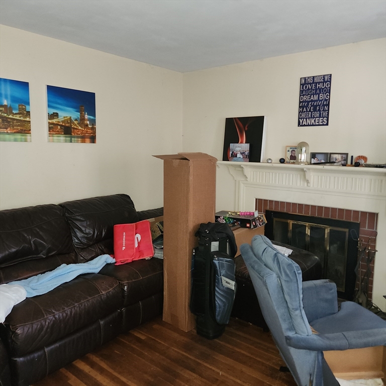 514 Dewey Street West Springfield, MA 01089 - Photo 7 of 42 a living room with furniture and a fireplace