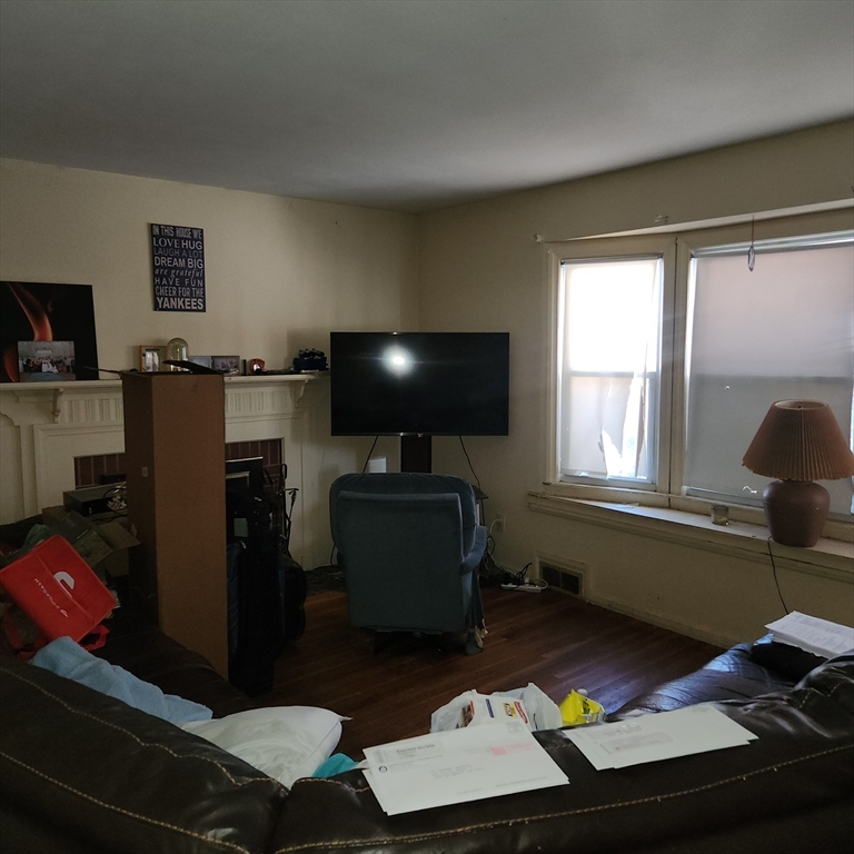 514 Dewey Street West Springfield, MA 01089 - Photo 9 of 42 a room with furniture and a window