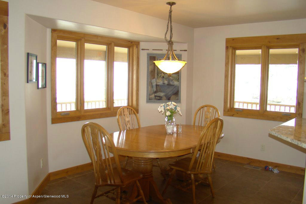 551 Deer Run Trail Rifle, CO 81650 - Photo 5 of 20 a view of a dining room with furniture window and outside view