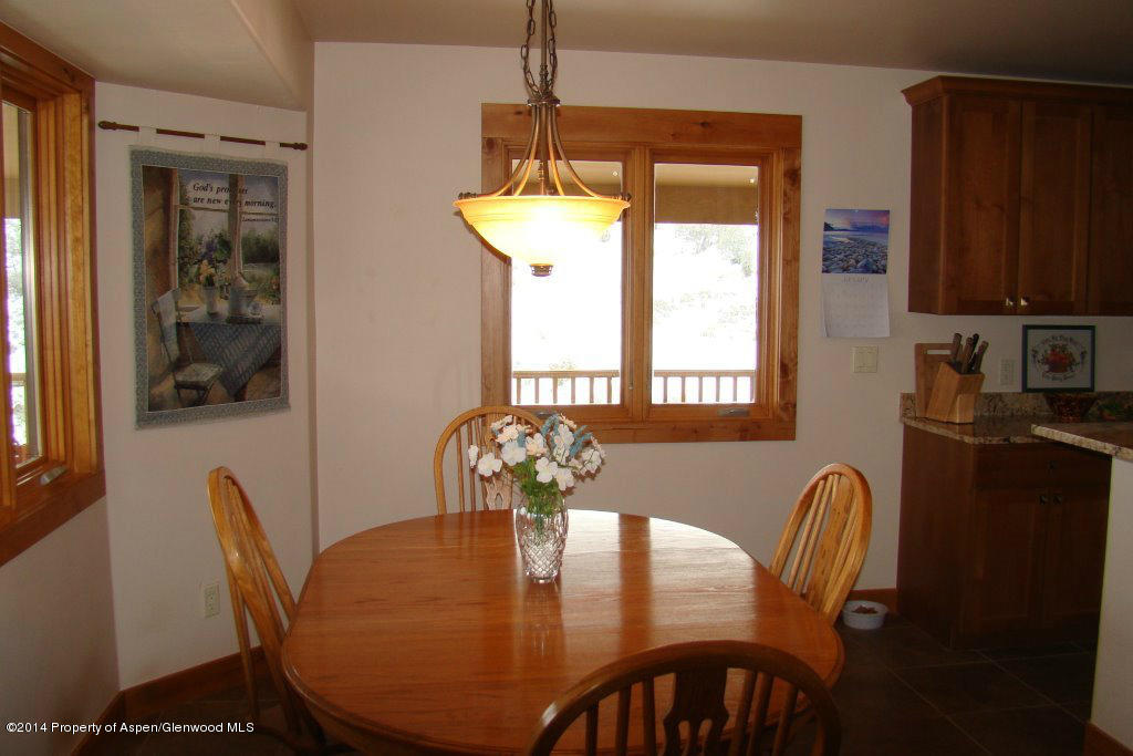 551 Deer Run Trail Rifle, CO 81650 - Photo 6 of 20 a view of a dining room with furniture window and outside view