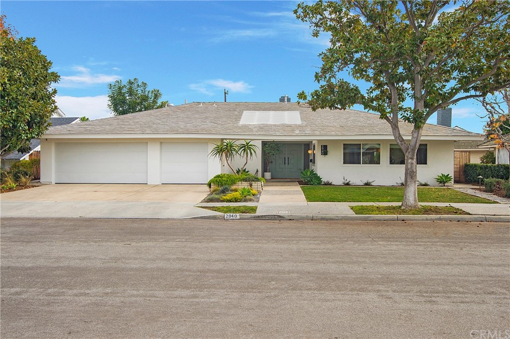 2940 Java Road Costa Mesa, CA 92626 - Photo 1 of 28 a view of a house with a backyard and a tree