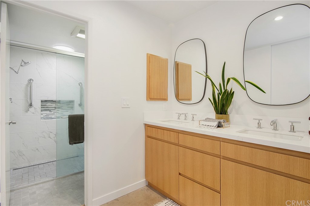 2940 Java Road Costa Mesa, CA 92626 - Photo 17 of 28 a bathroom with a double vanity sink and mirror