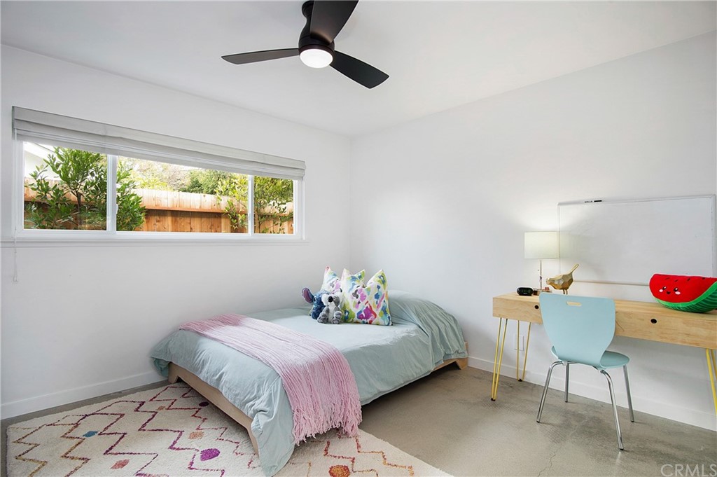 2940 Java Road Costa Mesa, CA 92626 - Photo 20 of 28 a bedroom with a bed and a chandelier