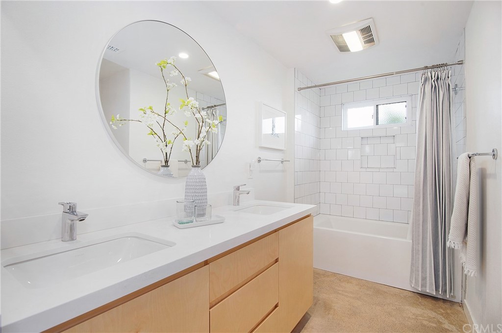2940 Java Road Costa Mesa, CA 92626 - Photo 22 of 28 a bathroom with a sink a shower and a mirror