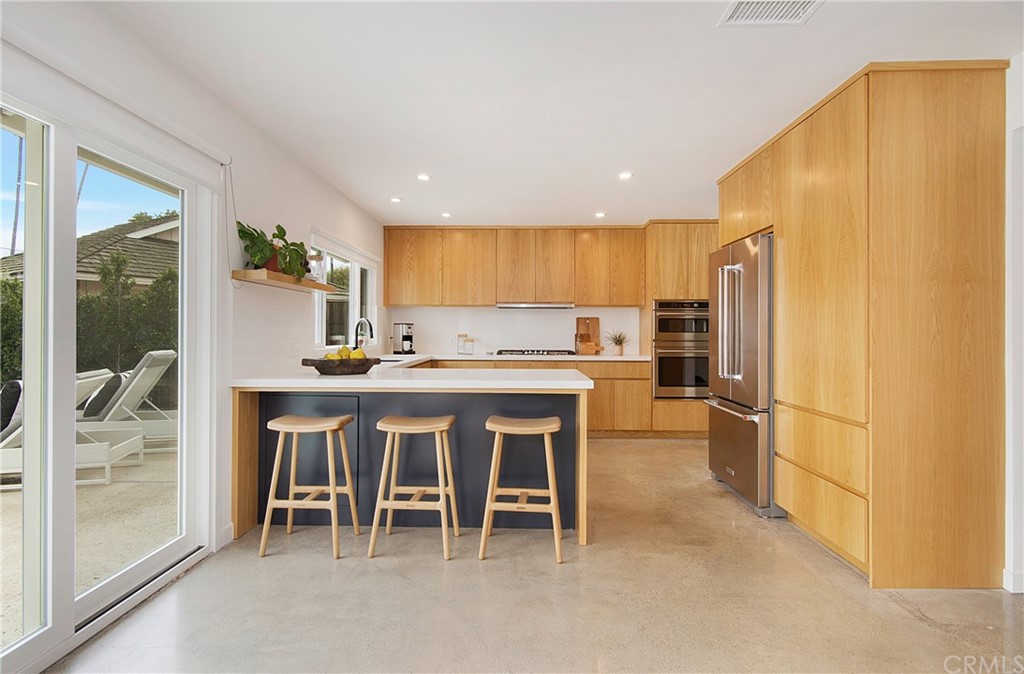 2940 Java Road Costa Mesa, CA 92626 - Photo 7 of 28 a kitchen with a table and chairs