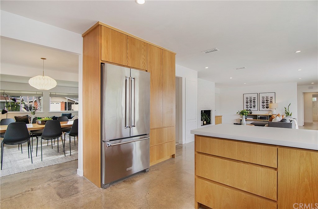 2940 Java Road Costa Mesa, CA 92626 - Photo 8 of 28 a kitchen with kitchen island a counter top space cabinets and stainless steel appliances