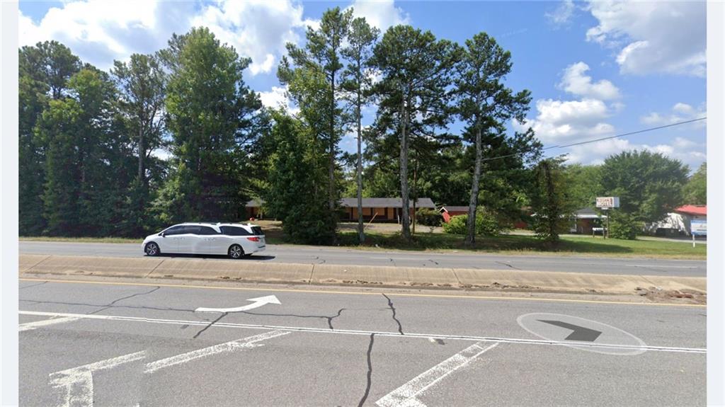 1022 Cassville Road Southeast Cartersville, GA 30120 - Photo 5 of 8 a car parked on the side of the road