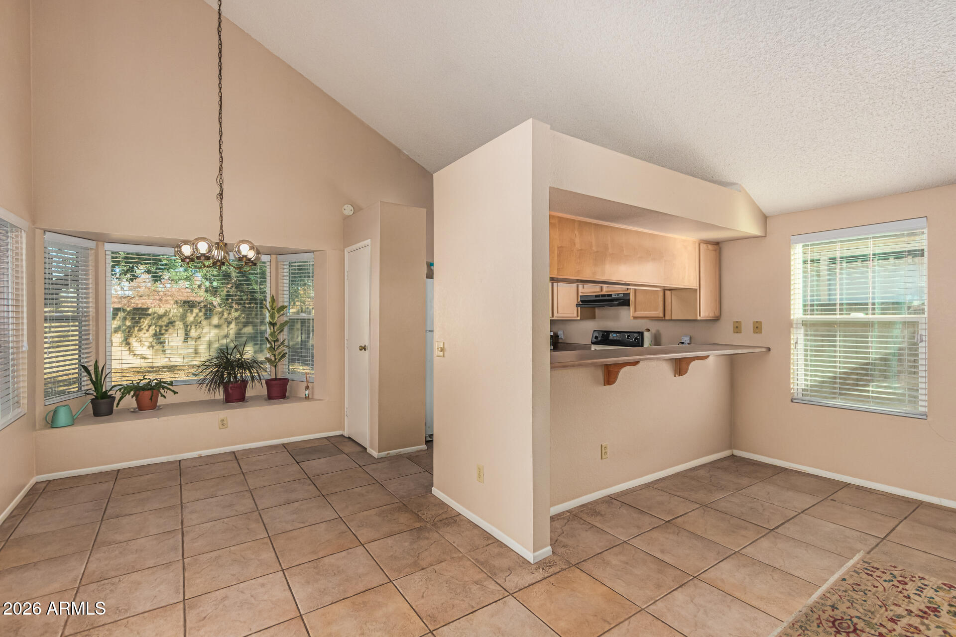3904 West Butler Street Chandler, AZ 85226 - Photo 13 of 30 a view of a kitchen with furniture and an entryway