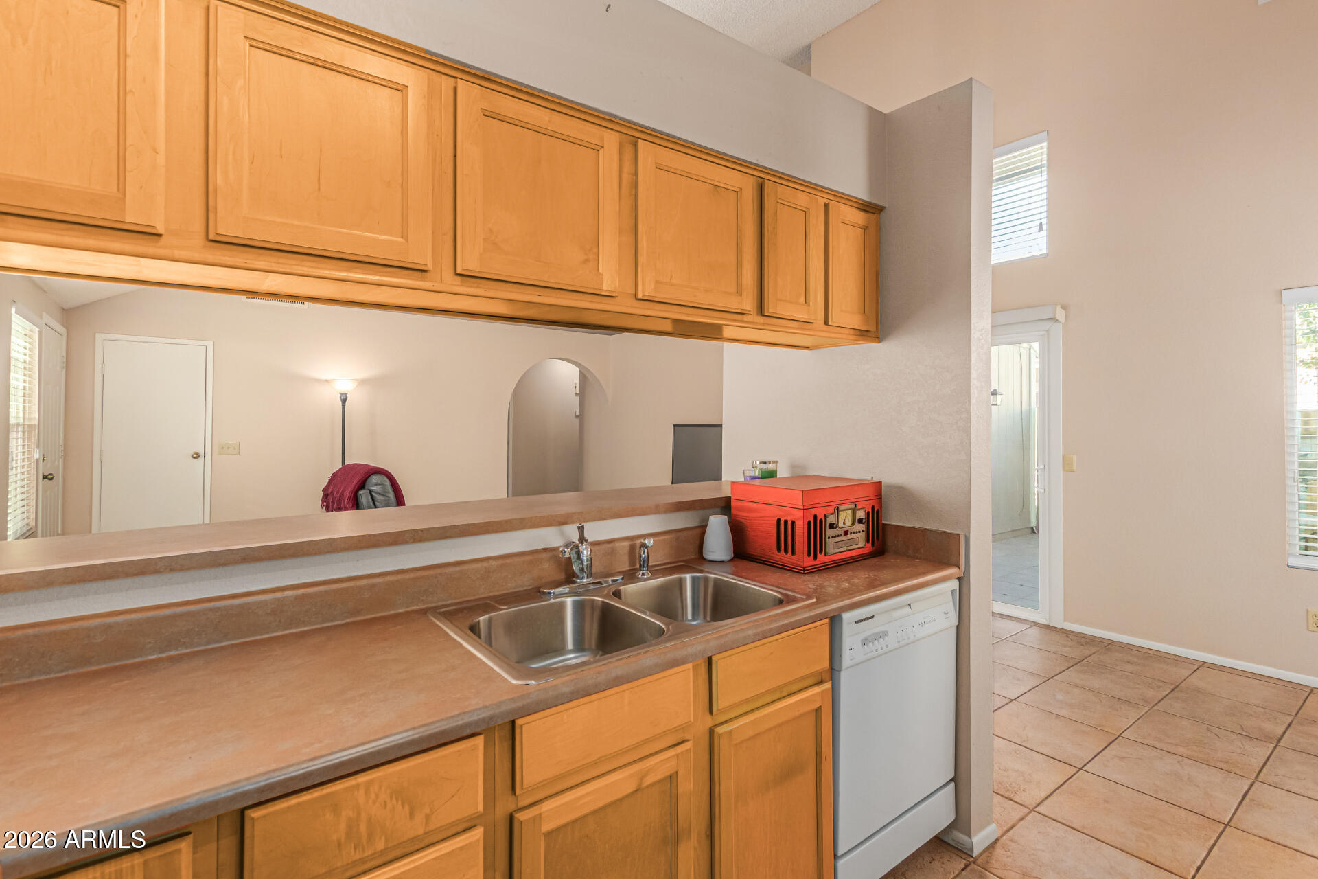 3904 West Butler Street Chandler, AZ 85226 - Photo 15 of 30 a kitchen with stainless steel appliances granite countertop a sink and cabinets