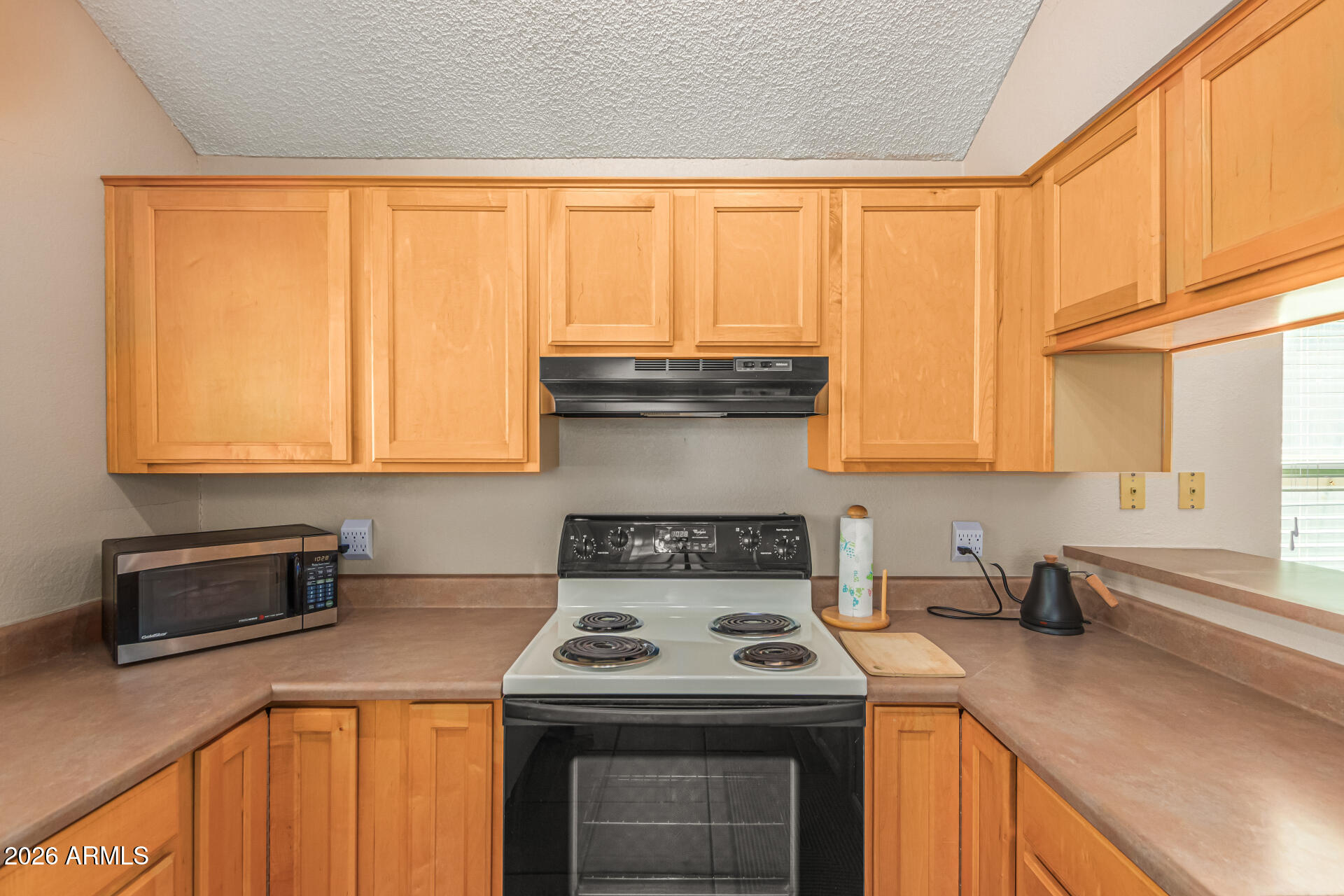 3904 West Butler Street Chandler, AZ 85226 - Photo 17 of 30 a kitchen with a stove and a sink