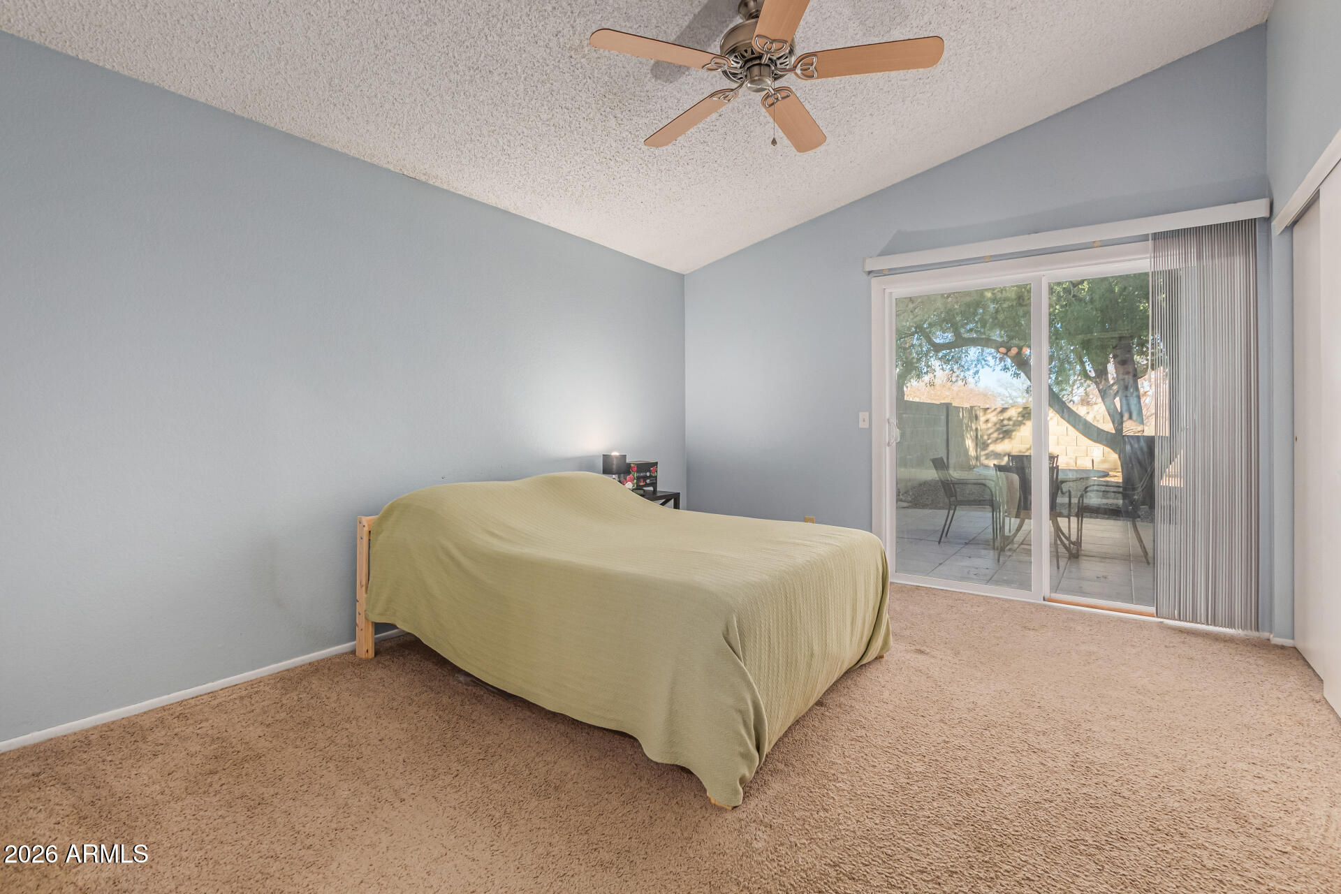 3904 West Butler Street Chandler, AZ 85226 - Photo 18 of 30 a spacious bedroom with a bed and glass door
