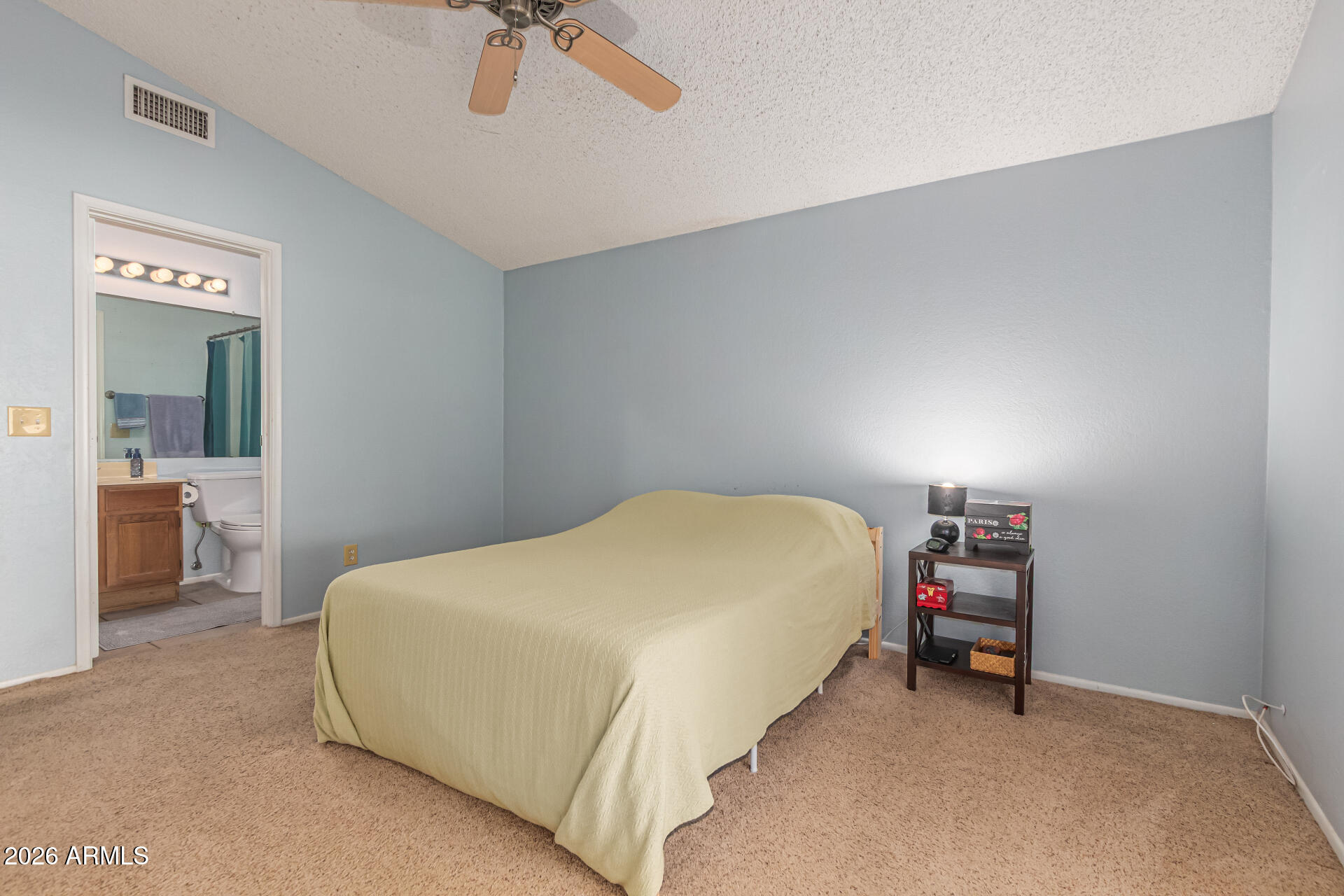 3904 West Butler Street Chandler, AZ 85226 - Photo 19 of 30 a bedroom with a bed and a chandelier