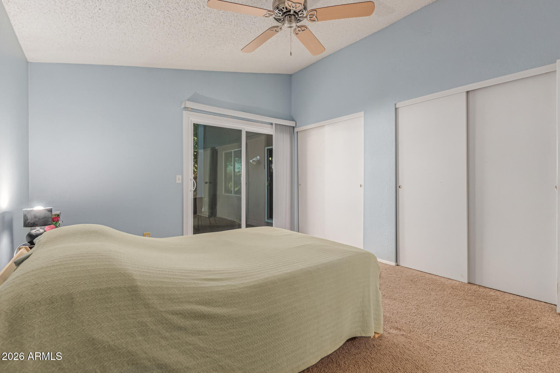 3904 West Butler Street Chandler, AZ 85226 - Photo 20 of 30 a bedroom with a bed and a chandelier