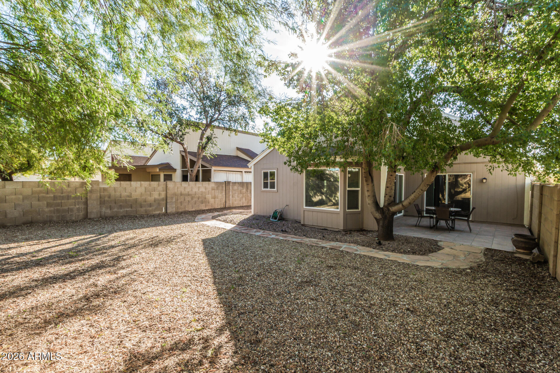 3904 West Butler Street Chandler, AZ 85226 - Photo 27 of 30 a view of a house with a yard and large tree