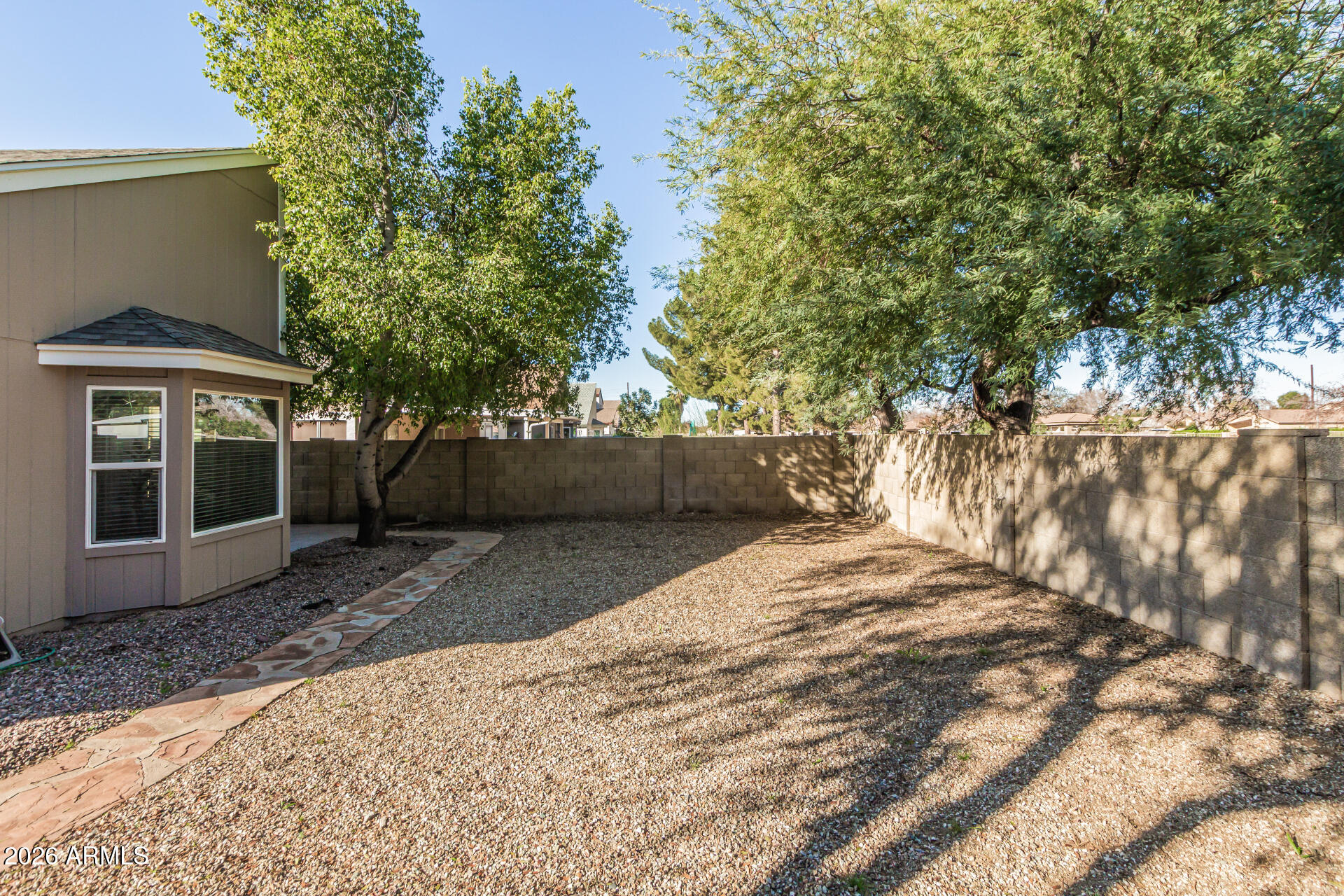 3904 West Butler Street Chandler, AZ 85226 - Photo 29 of 30 a view of a backyard with large trees and plants