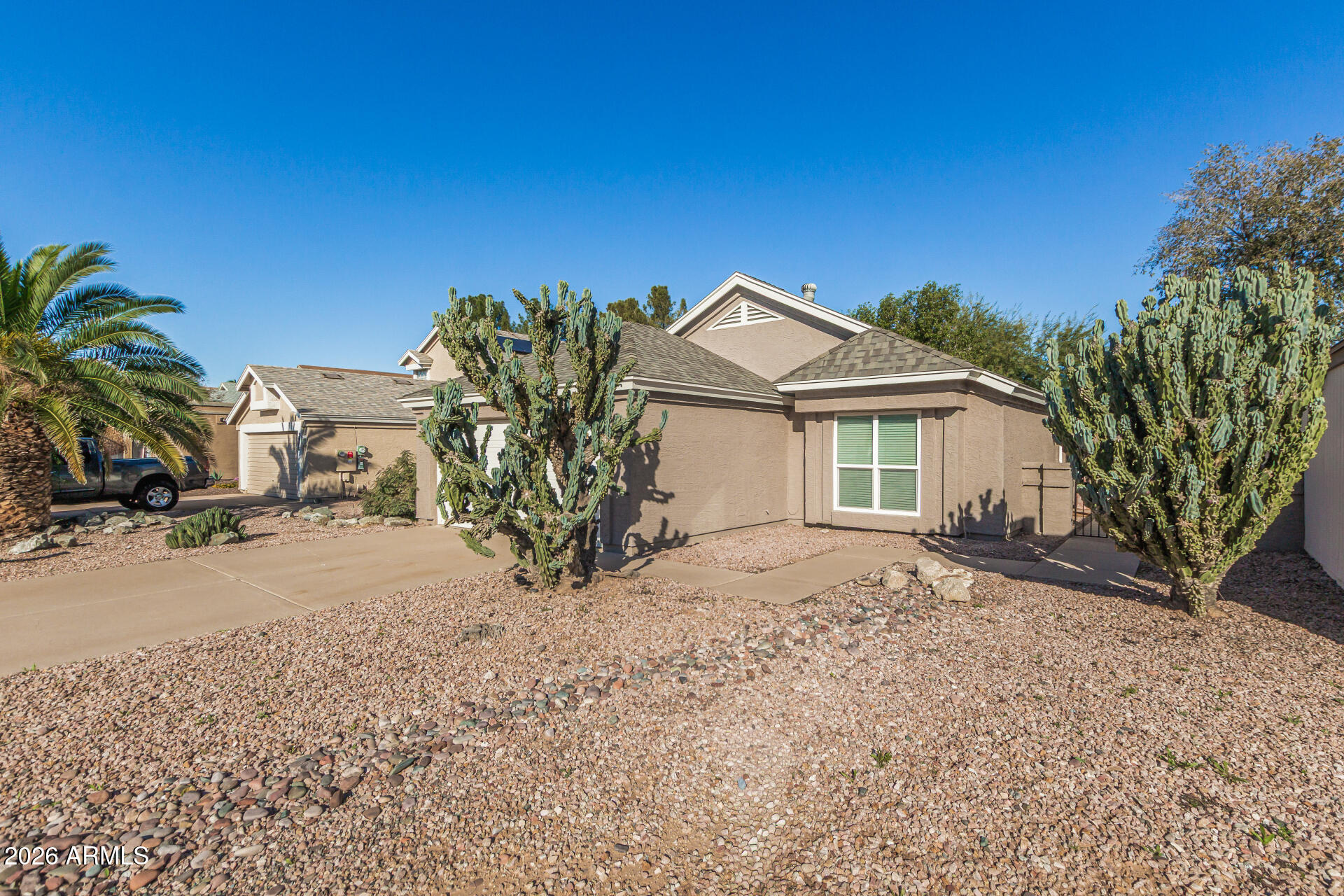 3904 West Butler Street Chandler, AZ 85226 - Photo 3 of 30 a view of a house with a tree in the background