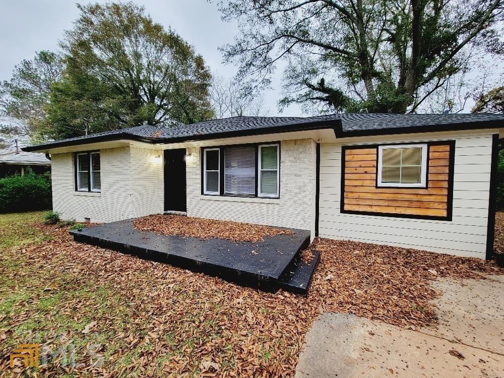 1994 Long Drive Decatur, GA 30032 - Photo 1 of 1 a front view of a house with a garden