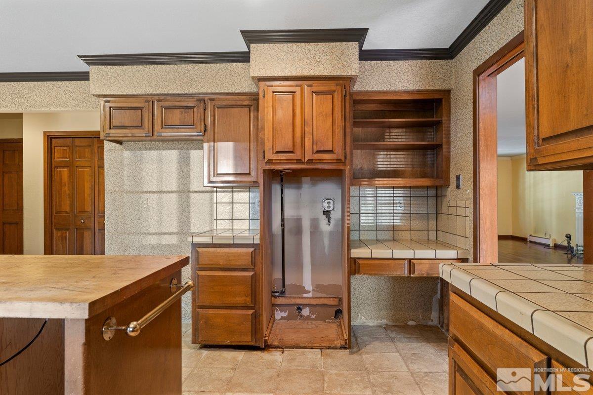 1120 Monroe Street Reno, NV 89509 - Photo 11 of 27 a kitchen with a refrigerator and a stove
