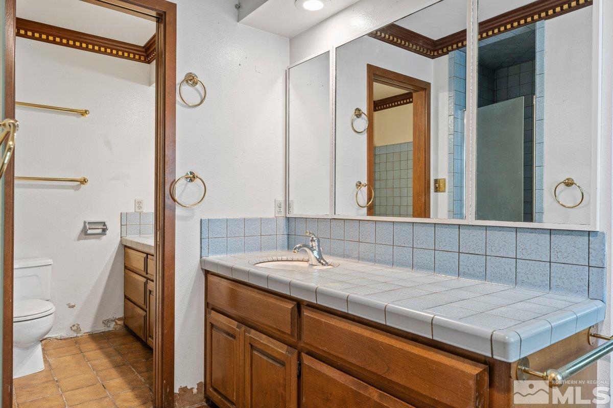1120 Monroe Street Reno, NV 89509 - Photo 17 of 27 a bathroom with a sink and a mirror