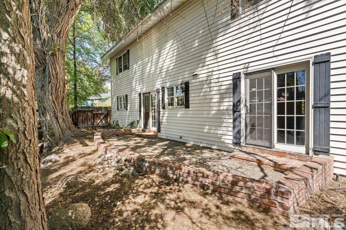 1120 Monroe Street Reno, NV 89509 - Photo 23 of 27 a front view of a house with a yard