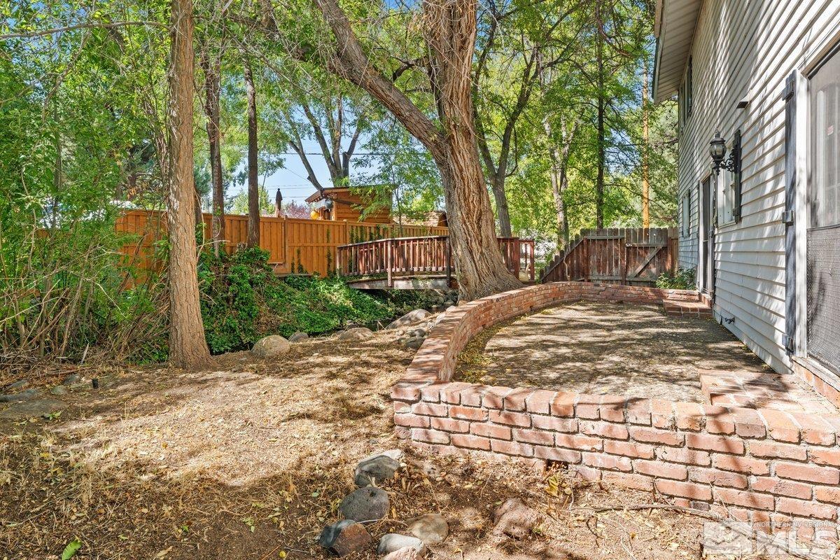 1120 Monroe Street Reno, NV 89509 - Photo 26 of 27 a view of a backyard with large trees
