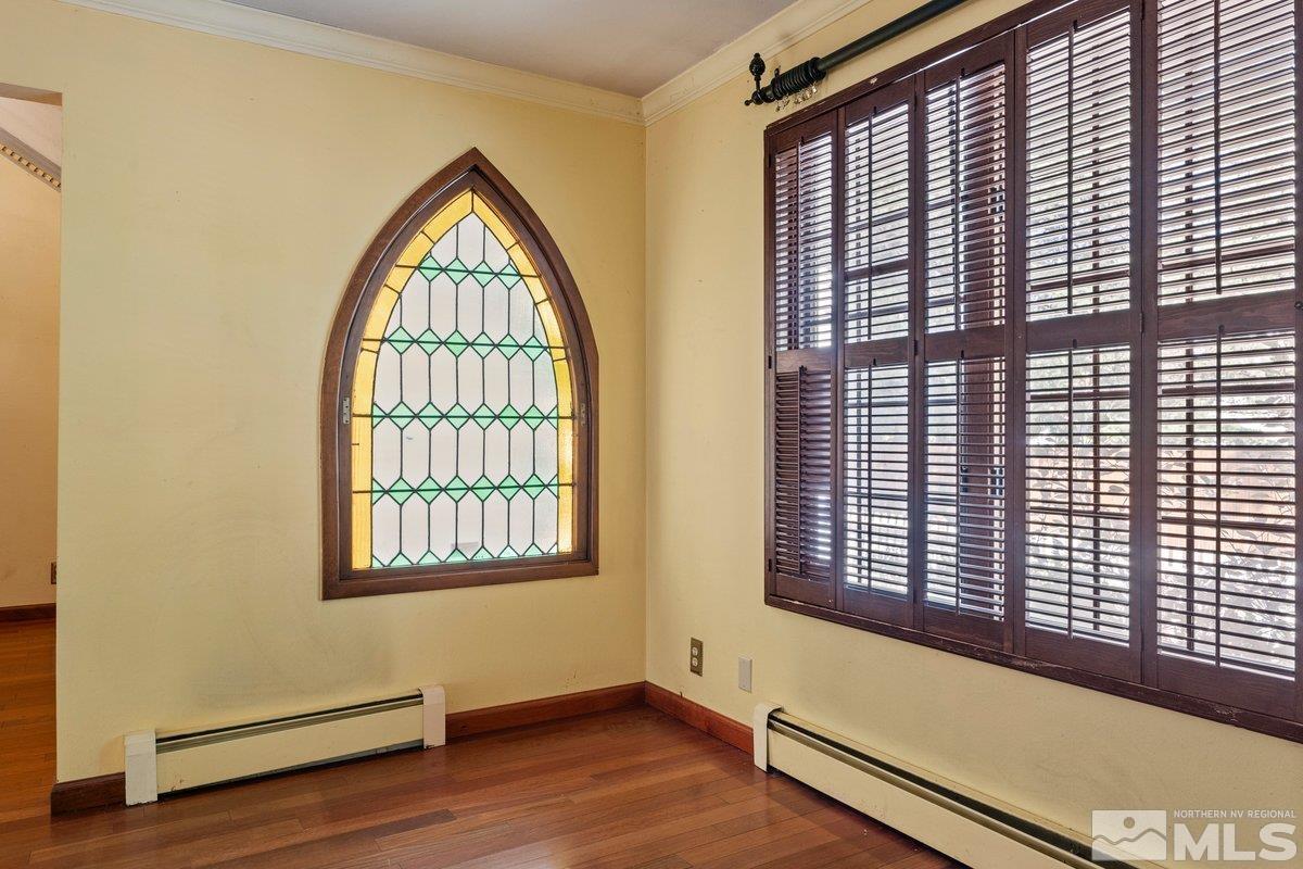 1120 Monroe Street Reno, NV 89509 - Photo 8 of 27 an empty room with wooden floor