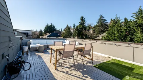 a view of a patio with couches chairs and potted plants