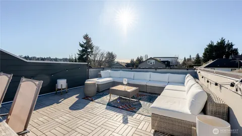 a view of a backyard with sitting area