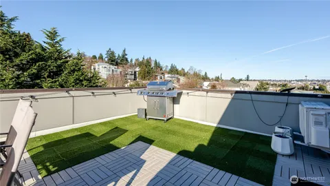 an aerial view of a house with lots of trees and plants