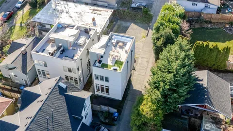 an aerial view of a house with a yard