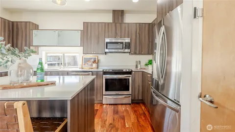 a kitchen with a refrigerator and a sink