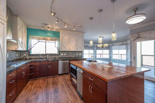 a view of a kitchen with a sink and a stove