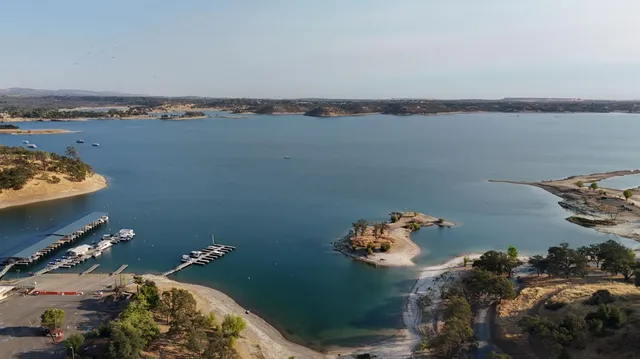 a large kitchen with granite countertop a stove and a sink